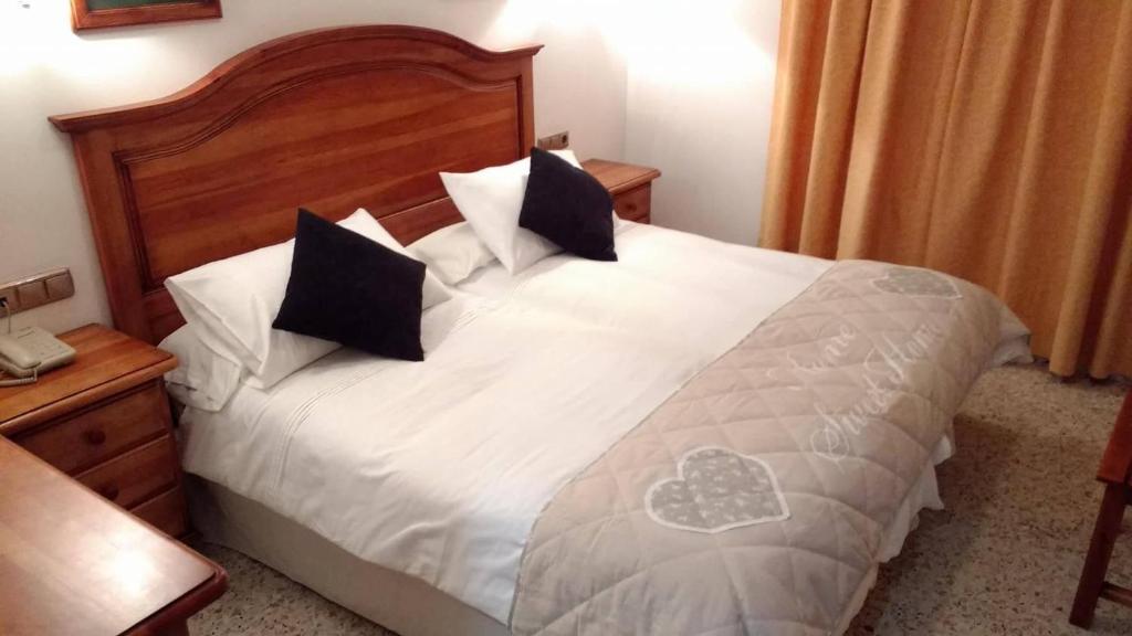 Postel nebo postele na pokoji v ubytování Hotel Bonilla
