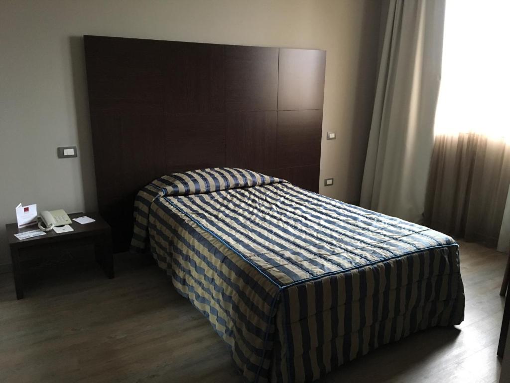 Postel nebo postele na pokoji v ubytování L'Angolo
