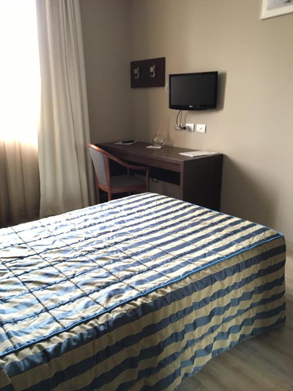 Postel nebo postele na pokoji v ubytování L'Angolo