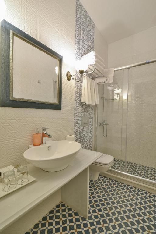 a bathroom with a sink and a toilet and a shower at Istanbul Life Hotel in Istanbul