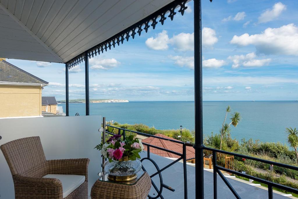 a balcony with a view of the ocean at Villa Mentone Hotel in Shanklin