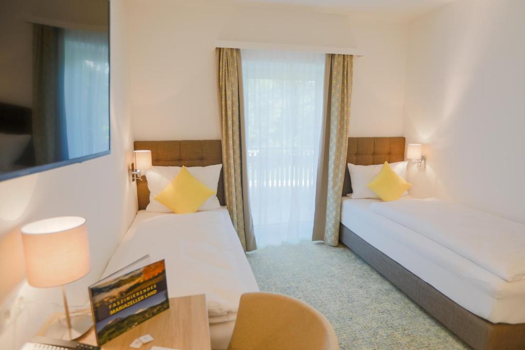 Postel nebo postele na pokoji v ubytování R&R Residenzen HOTEL