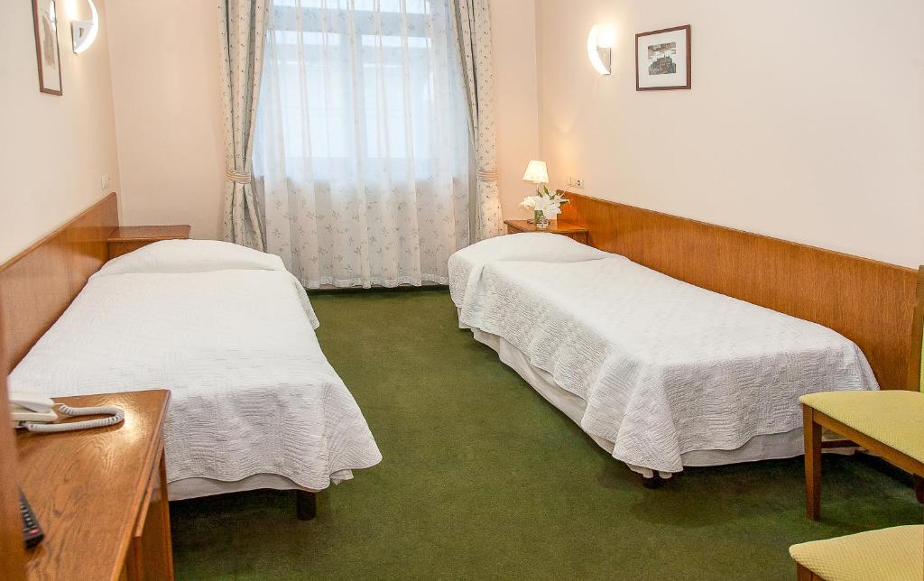 Ein Bett oder Betten in einem Zimmer der Unterkunft Willa Biala Lilia Old Town