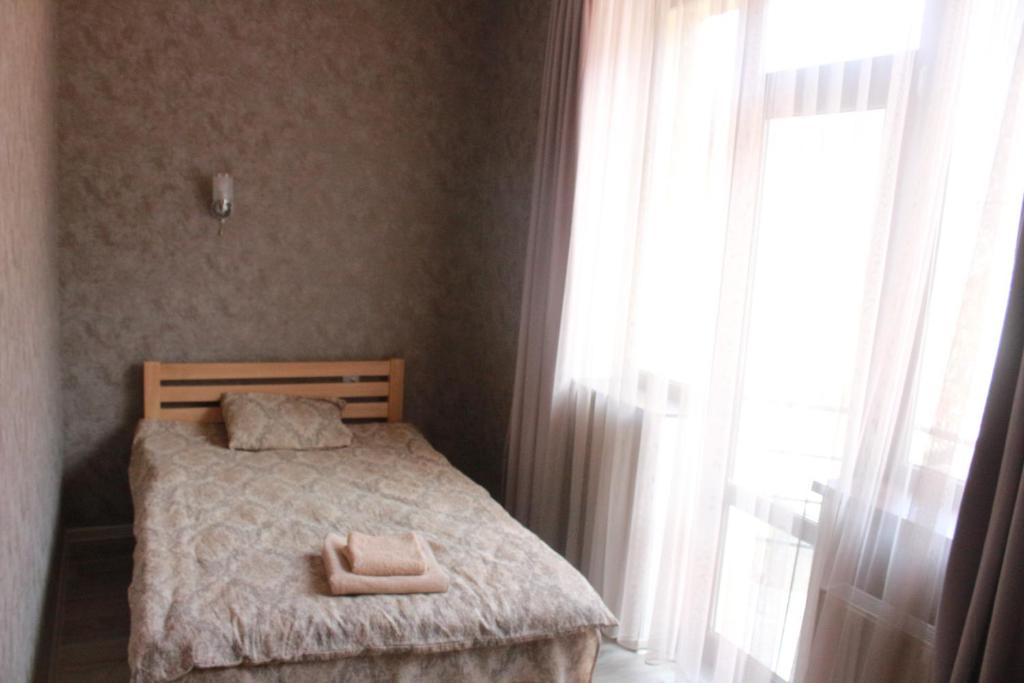 Ένα ή περισσότερα κρεβάτια σε δωμάτιο στο Hotel Gergeti