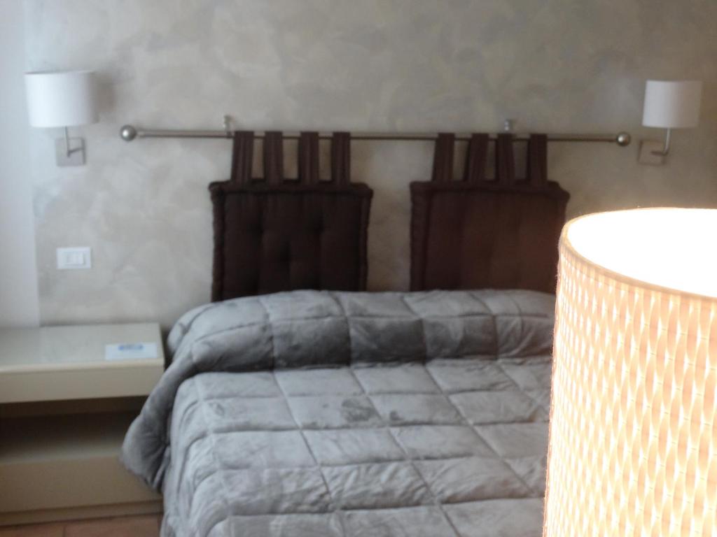 Postel nebo postele na pokoji v ubytování Locanda Il Burchiello