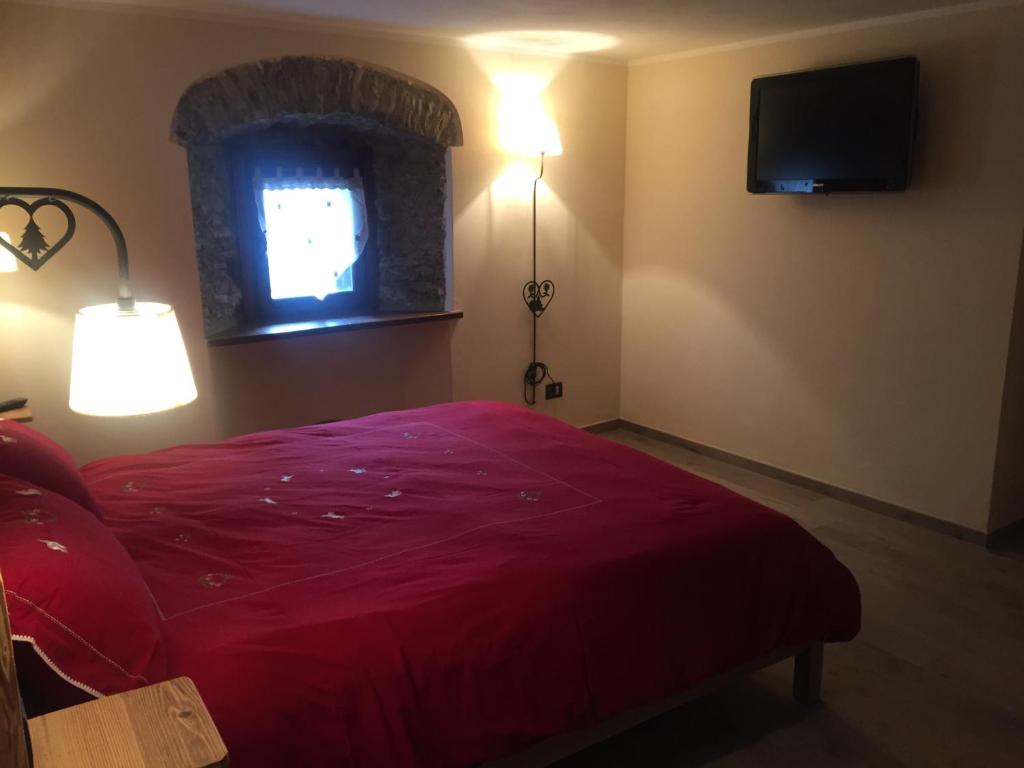 A bed or beds in a room at La Boule de Neige