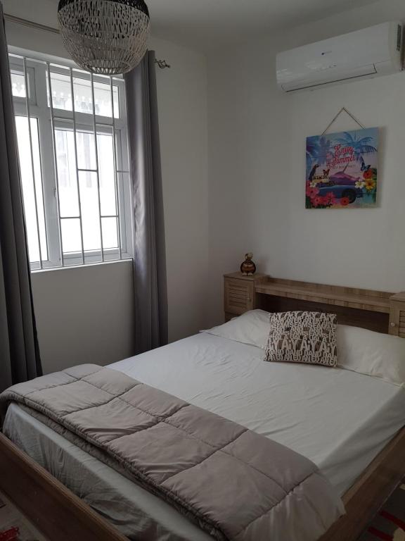 Кровать или кровати в номере Villa Bienvenue Beachfront House