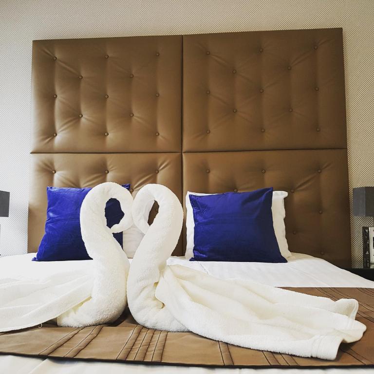Postel nebo postele na pokoji v ubytování Hotel Zilt