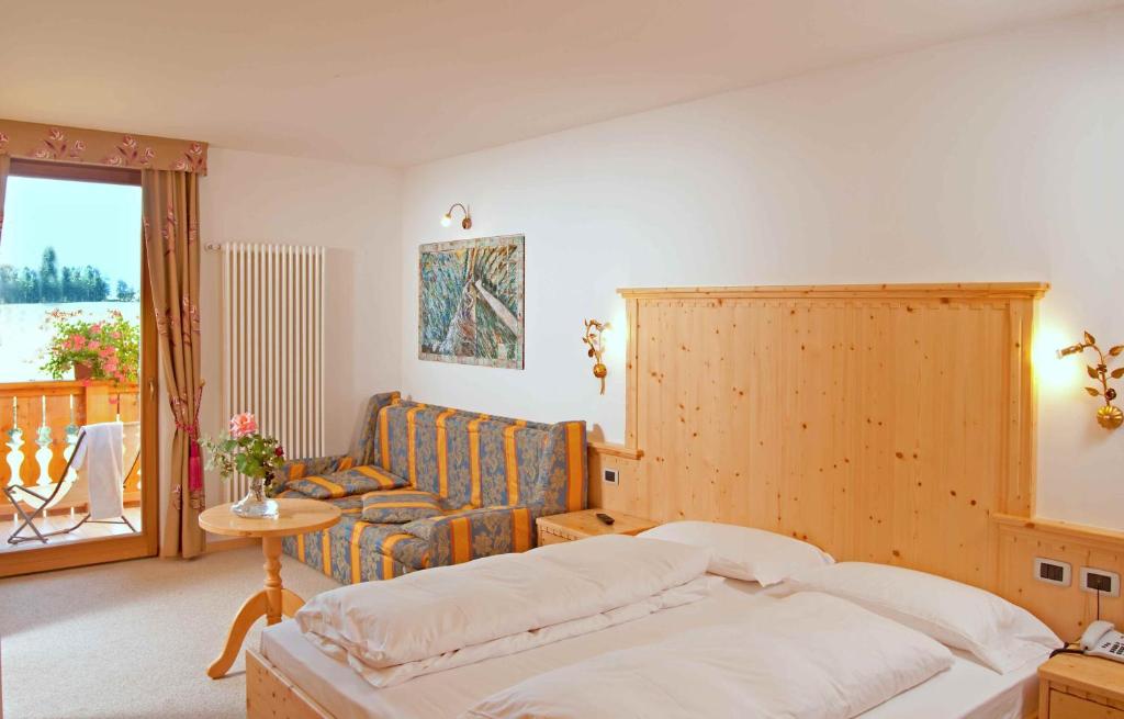Postel nebo postele na pokoji v ubytování Hotel Rosa Resort