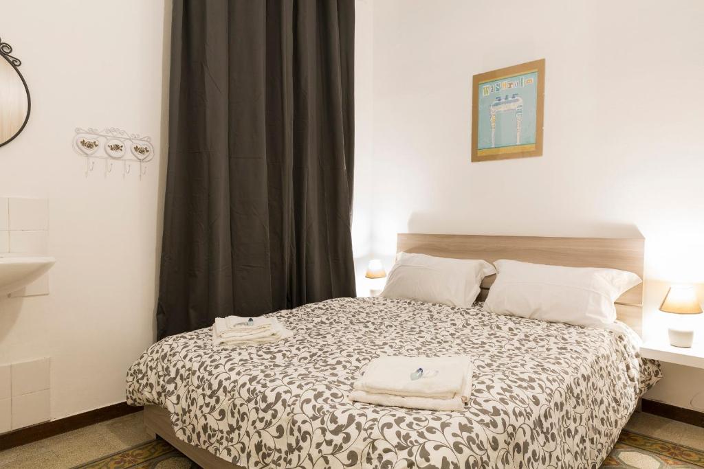 Łóżko lub łóżka w pokoju w obiekcie Central Apartment Navona Square