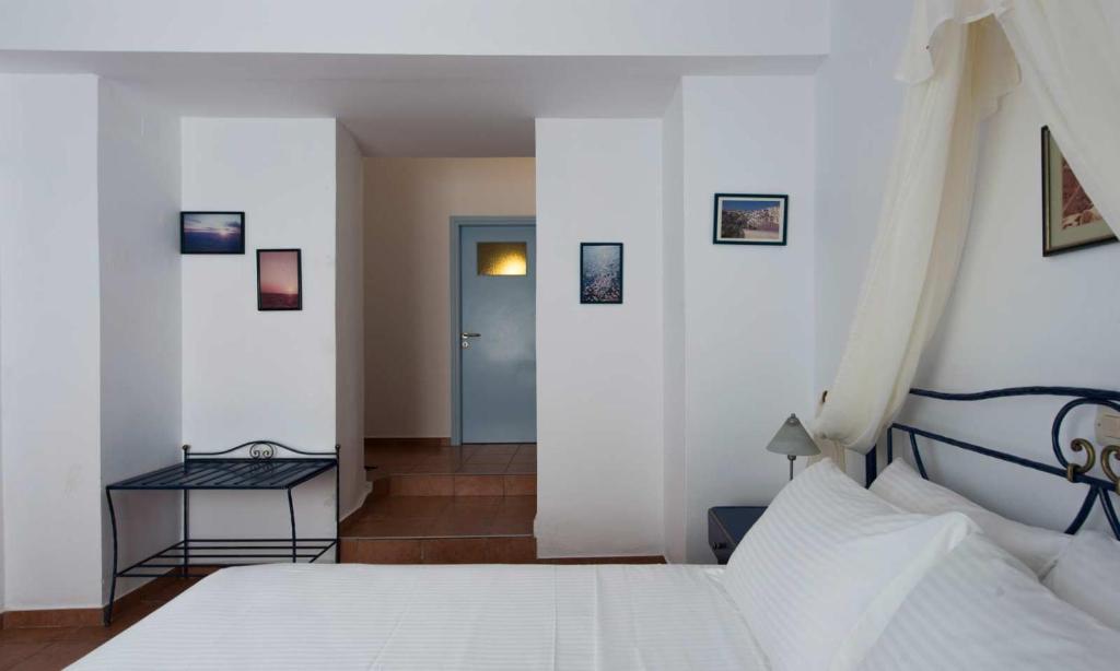 Łóżko lub łóżka w pokoju w obiekcie Kastro Suites
