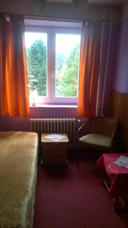 Postel nebo postele na pokoji v ubytování Penzion Lipůvka