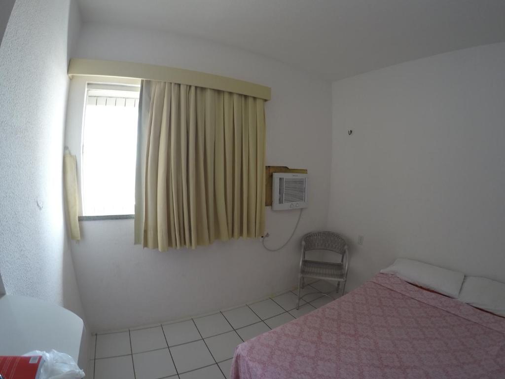 Cama ou camas em um quarto em Apartamento em Fortaleza em frente a praia do Futuro