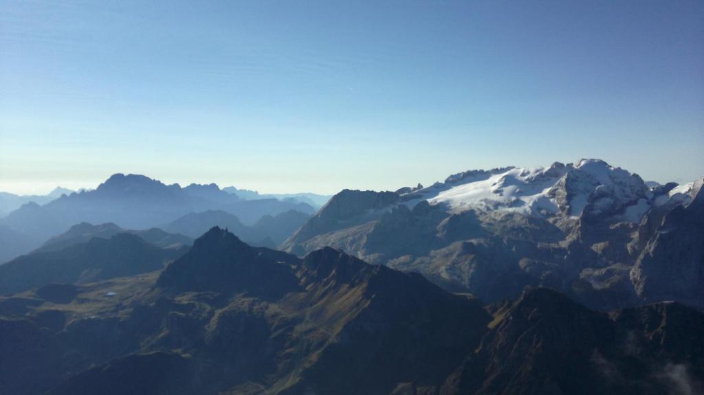 a view of a mountain range with snow capped mountains at Digonera Historic Hotel B&B in Rocca Pietore