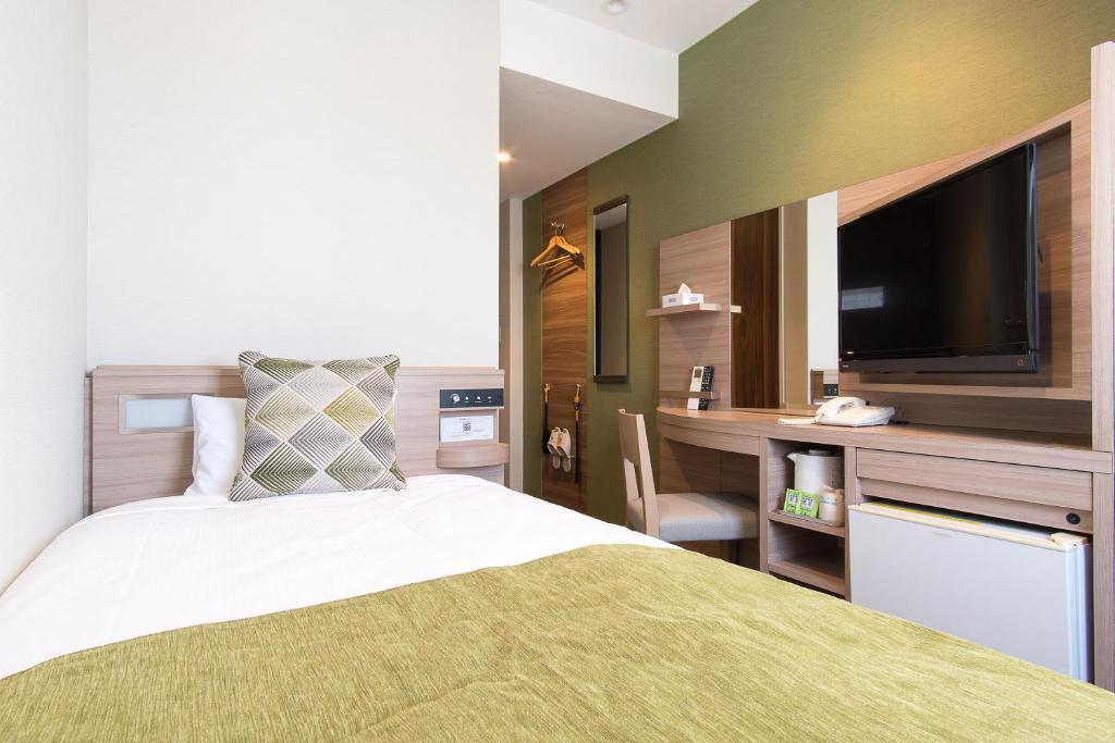 Postel nebo postele na pokoji v ubytování Fujinomiya Fujikyu Hotel