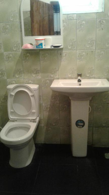 Koupelna v ubytování Kalana Homestay