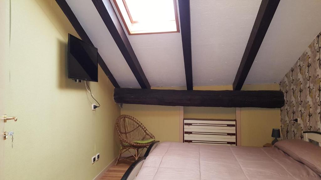 Postel nebo postele na pokoji v ubytování B&B Casa Arcangeli