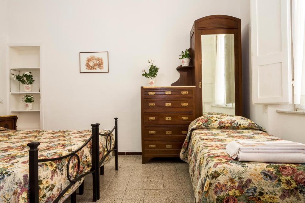 Postel nebo postele na pokoji v ubytování Albergo Tre Donzelle