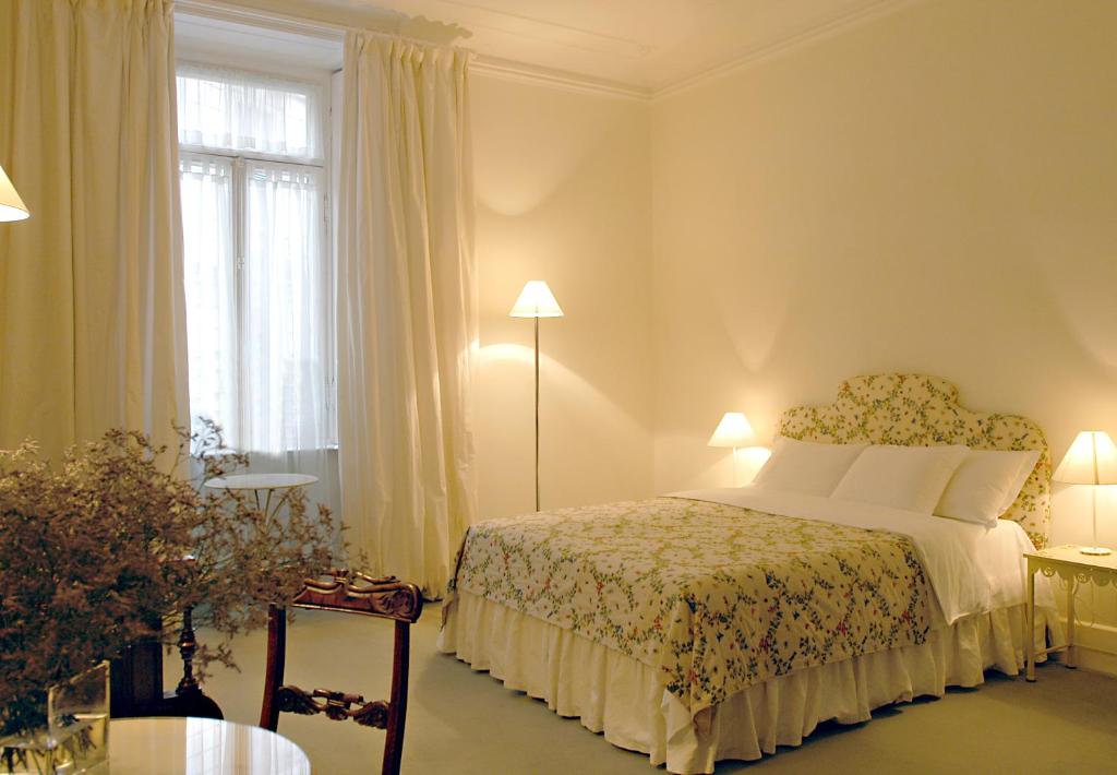 A bed or beds in a room at Milano Suites