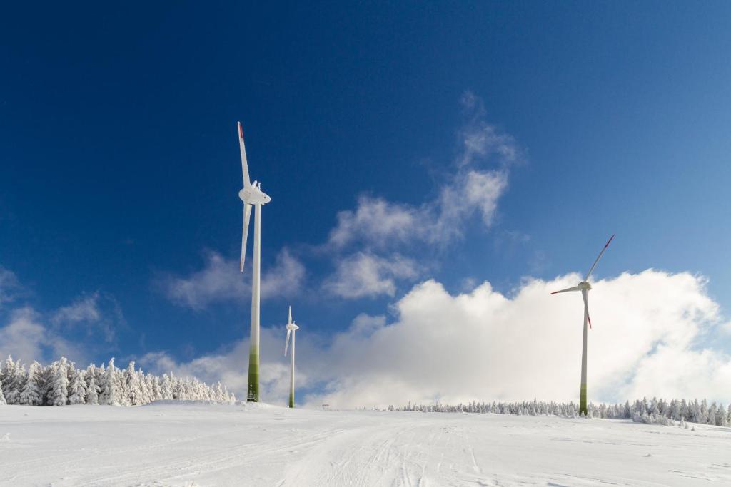 a group of wind turbines in the snow at Studio Krušné Hory Klínovec in Loučná pod Klínovcem