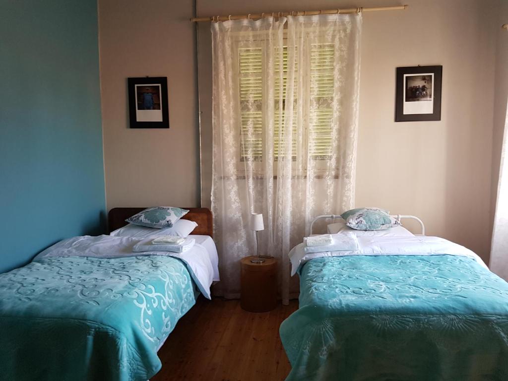 Postel nebo postele na pokoji v ubytování Ines Guest House