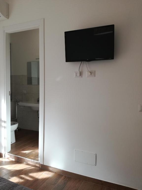 Televízia a/alebo spoločenská miestnosť v ubytovaní La casa di Alice