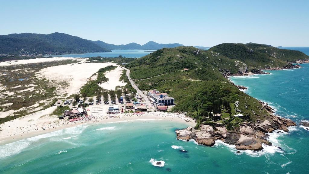 an aerial view of a beach and the ocean at Cris Hotel in Florianópolis