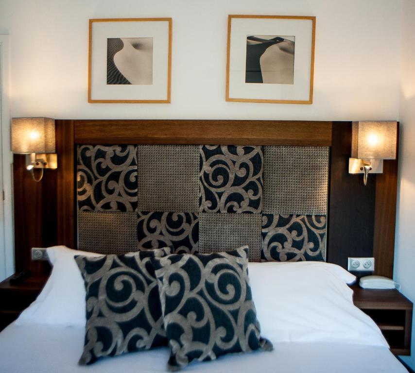 Postel nebo postele na pokoji v ubytování Hotel B Lodge