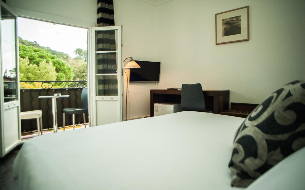 Postel nebo postele na pokoji v ubytování Hotel B Lodge