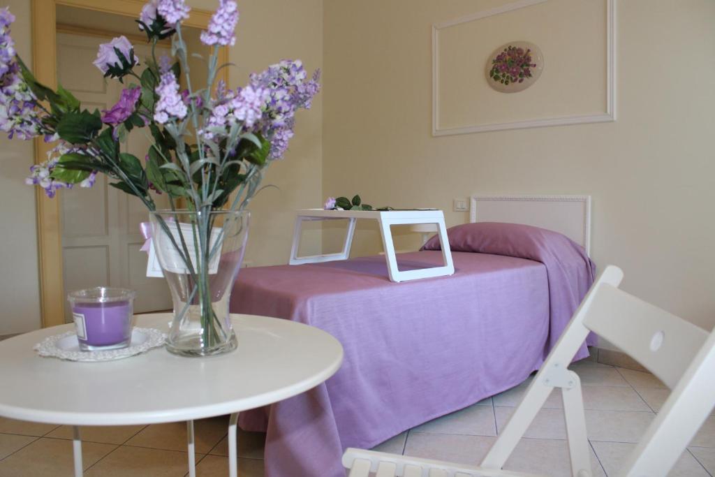 Postel nebo postele na pokoji v ubytování B&B Bouquet di fiori