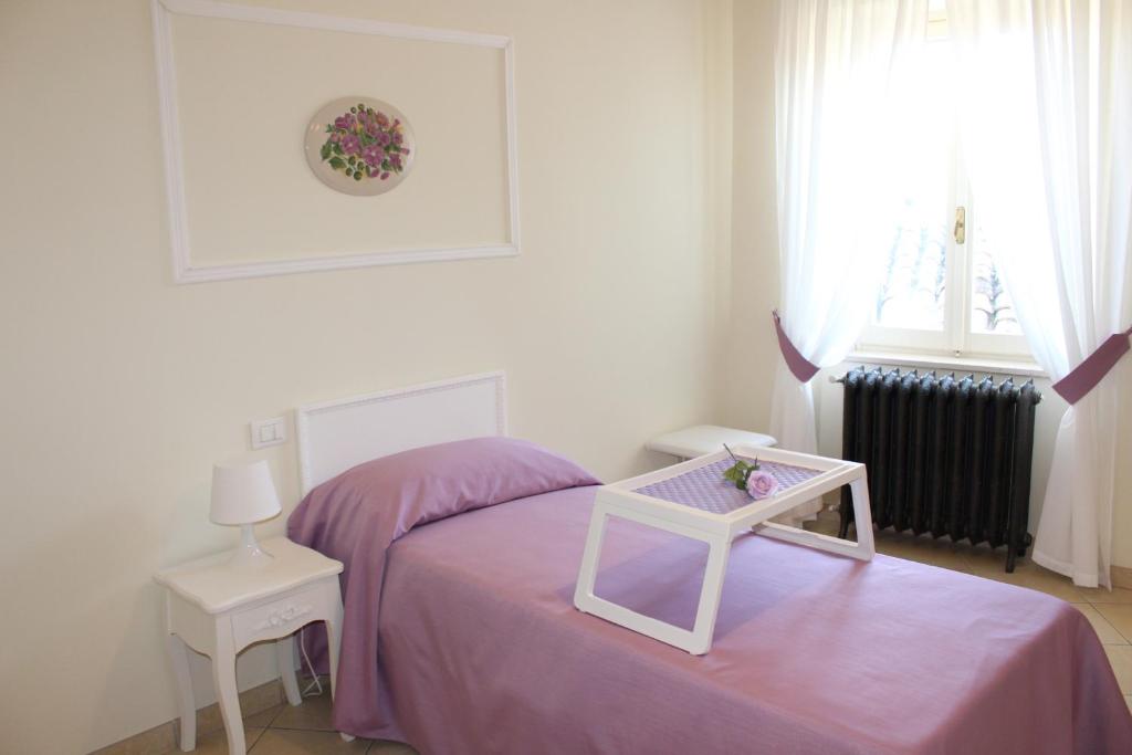 Postel nebo postele na pokoji v ubytování B&B Bouquet di fiori