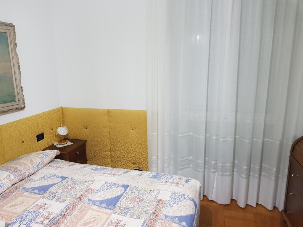 A bed or beds in a room at B&B Cavaliere Milano