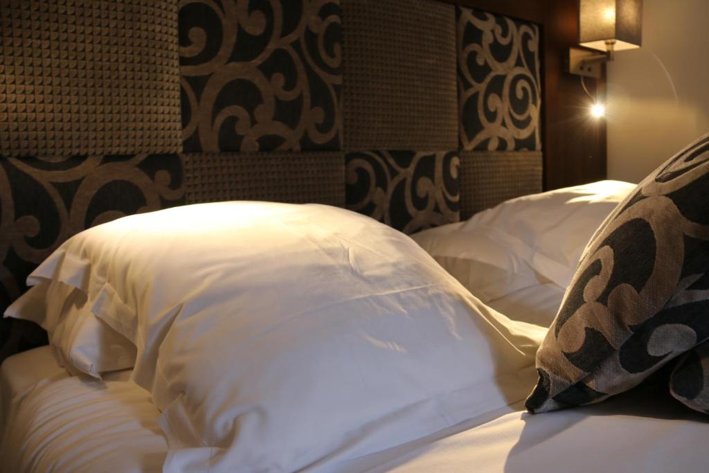 Postel nebo postele na pokoji v ubytování Hotel B Lodge