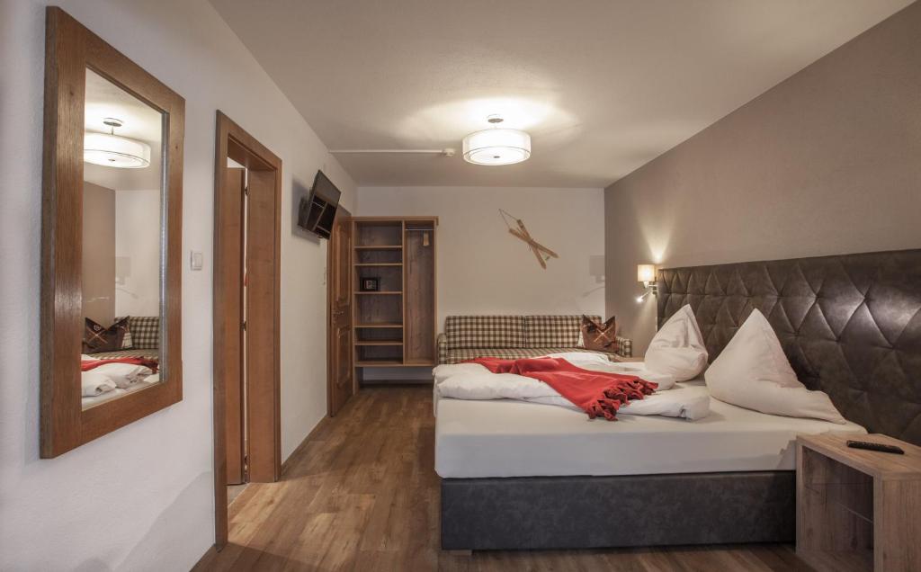 Postel nebo postele na pokoji v ubytování Apart Hotel Arno