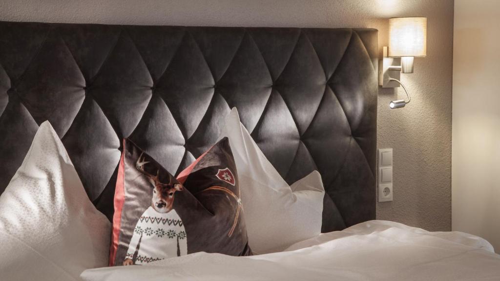 Postel nebo postele na pokoji v ubytování Apart Hotel Arno