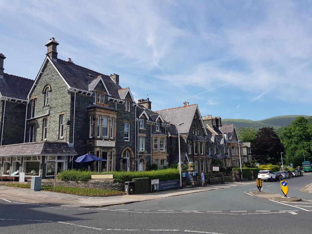 a row of houses on a street in a town at Keswick Park Hotel in Keswick