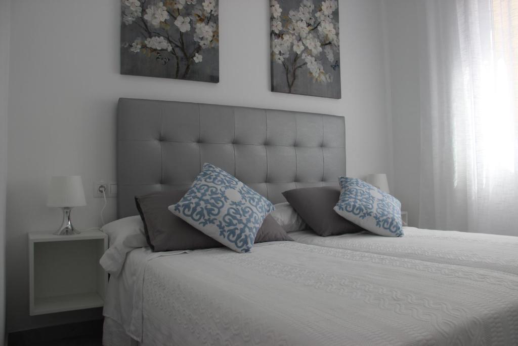 Posteľ alebo postele v izbe v ubytovaní Atarazana Apartment