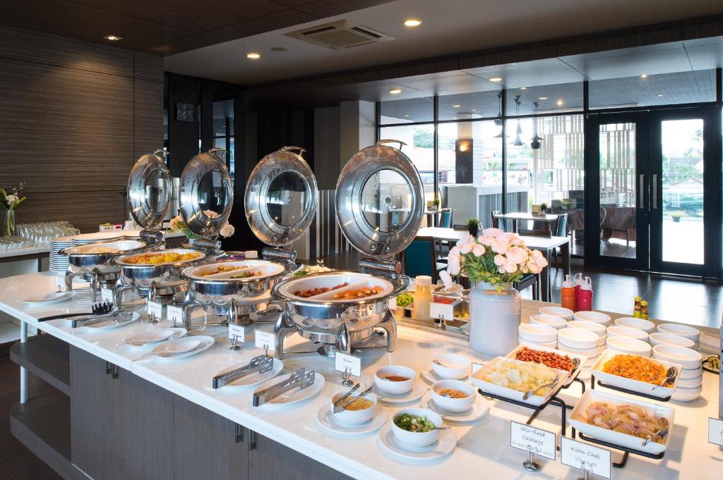 a buffet line with various food items on display at Simplitel in Karon Beach