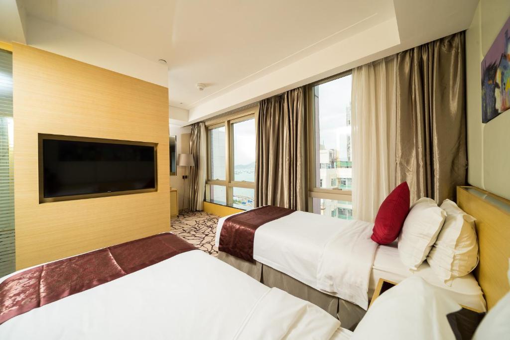 Un pat sau paturi într-o cameră la Eco Tree Hotel