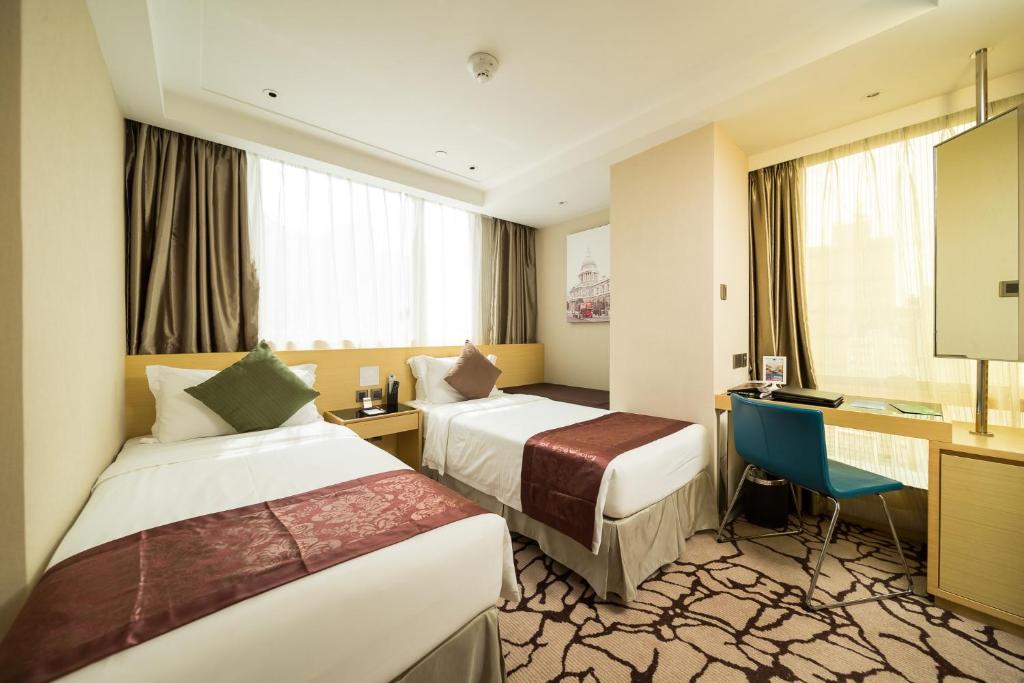 Un pat sau paturi într-o cameră la Eco Tree Hotel