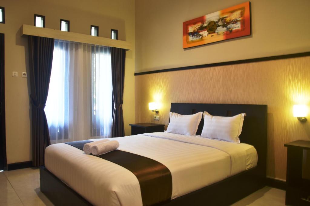 Postel nebo postele na pokoji v ubytování Hotel Orizatha