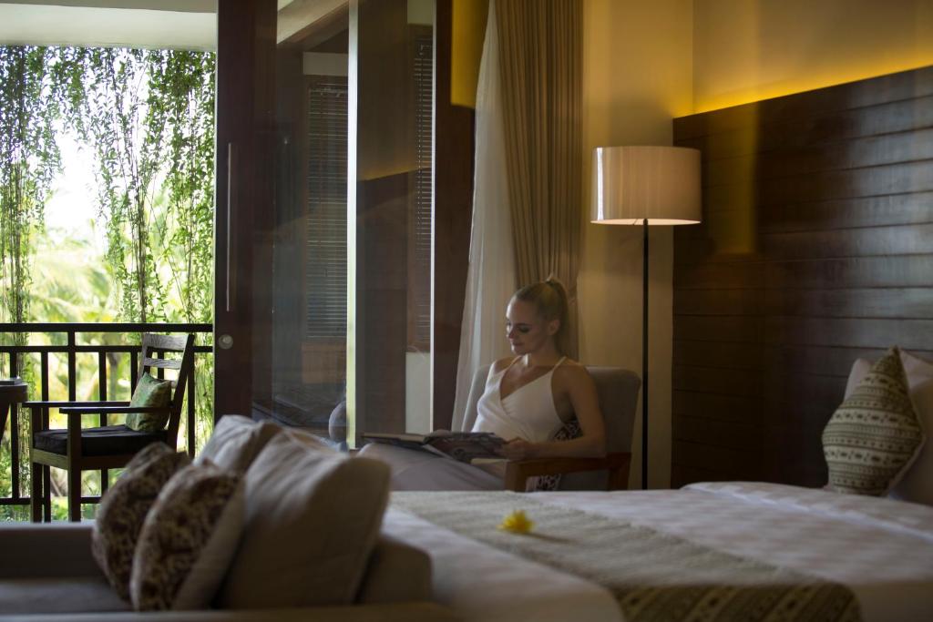 Postel nebo postele na pokoji v ubytování Ubud Village Hotel
