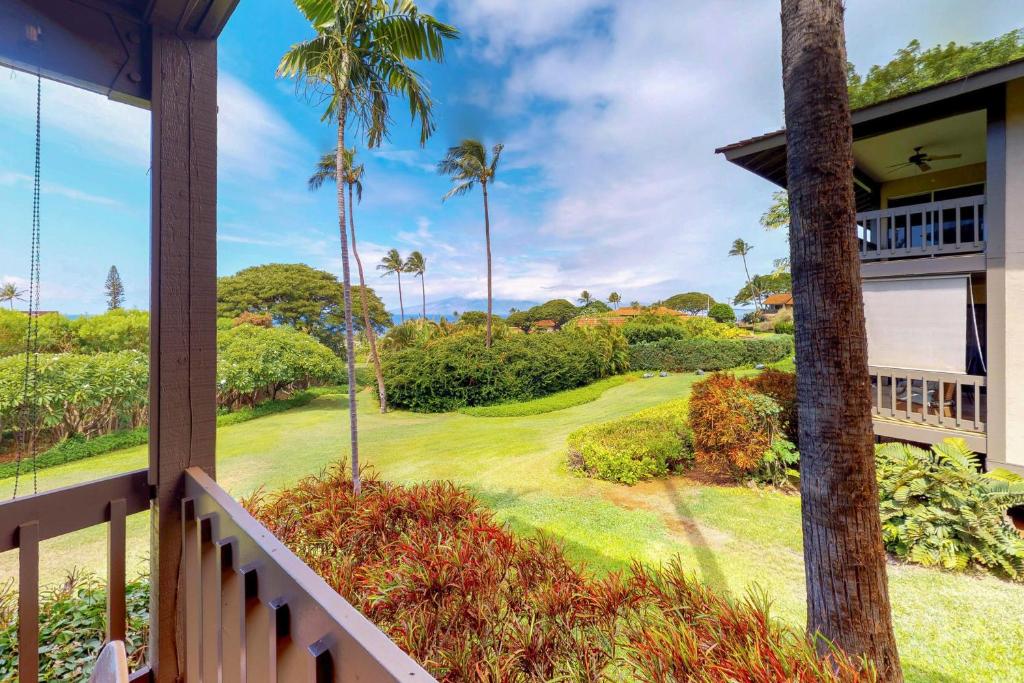 a view from the balcony of a resort with palm trees at Kaanapali Plantation Condominiums in Kaanapali
