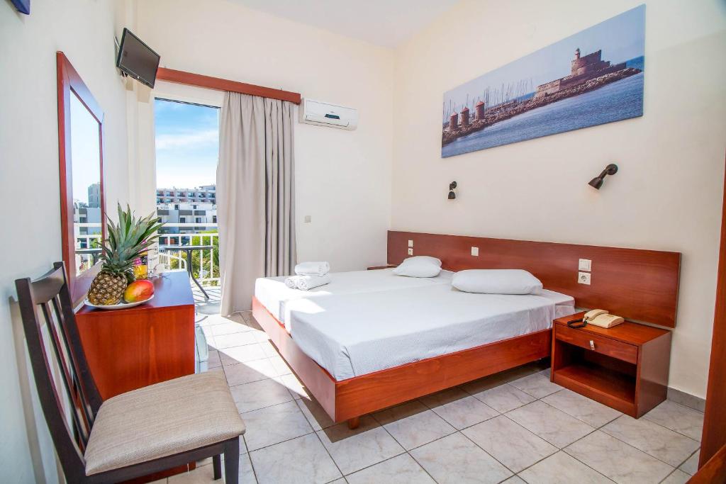 Postel nebo postele na pokoji v ubytování Filmar Hotel, Ixia, Rhodes