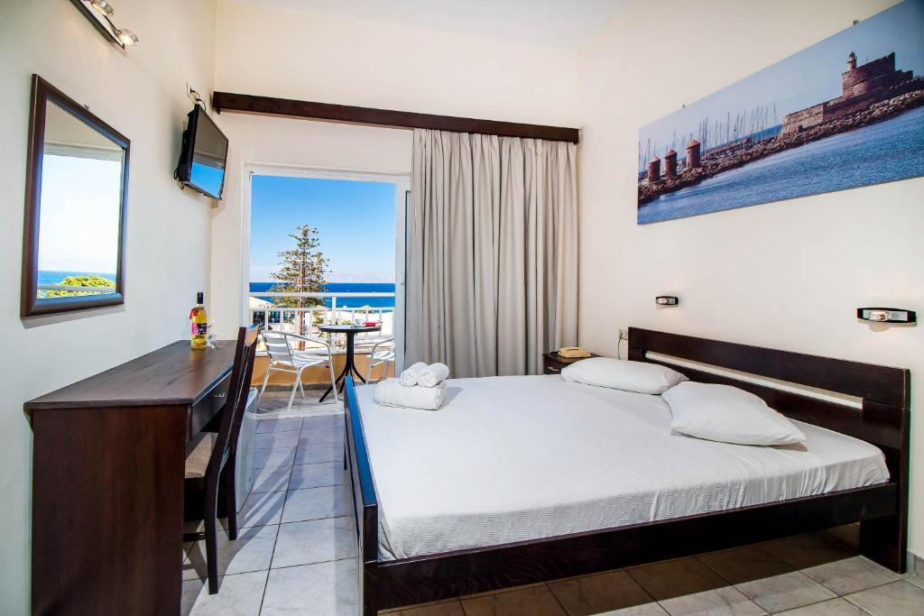 Postel nebo postele na pokoji v ubytování Filmar Hotel, Ixia, Rhodes