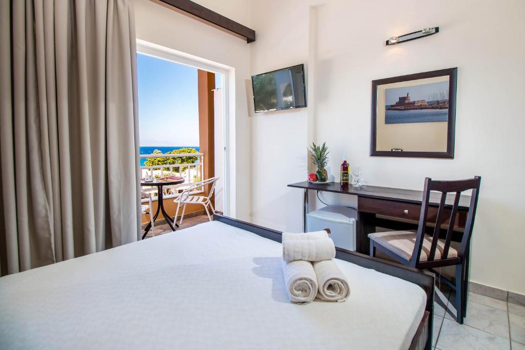 Postel nebo postele na pokoji v ubytování Filmar Hotel, Ixia, Rhodes