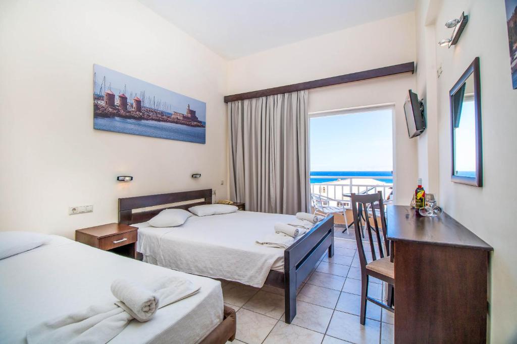 Postel nebo postele na pokoji v ubytování Filmar Hotel, Ixia, Rhodes
