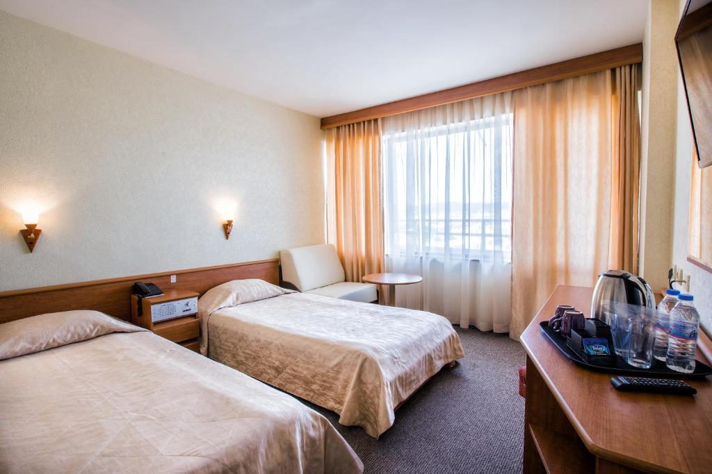 Postel nebo postele na pokoji v ubytování Kuban Resort & Aquapark - All Inclusive