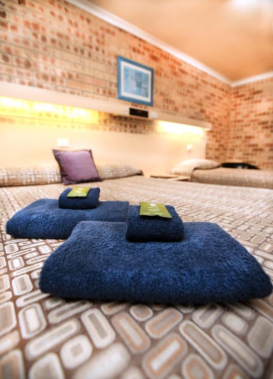 Postel nebo postele na pokoji v ubytování Central Motel Gin Gin