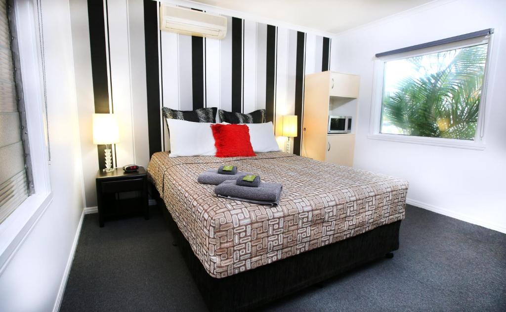 Postel nebo postele na pokoji v ubytování Central Motel Gin Gin